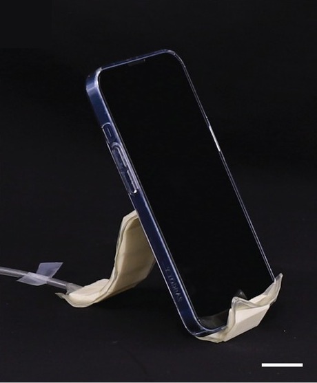 A phone resting on the stand